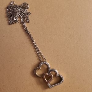 14k gold and sterling silver heart necklace with diamond accents